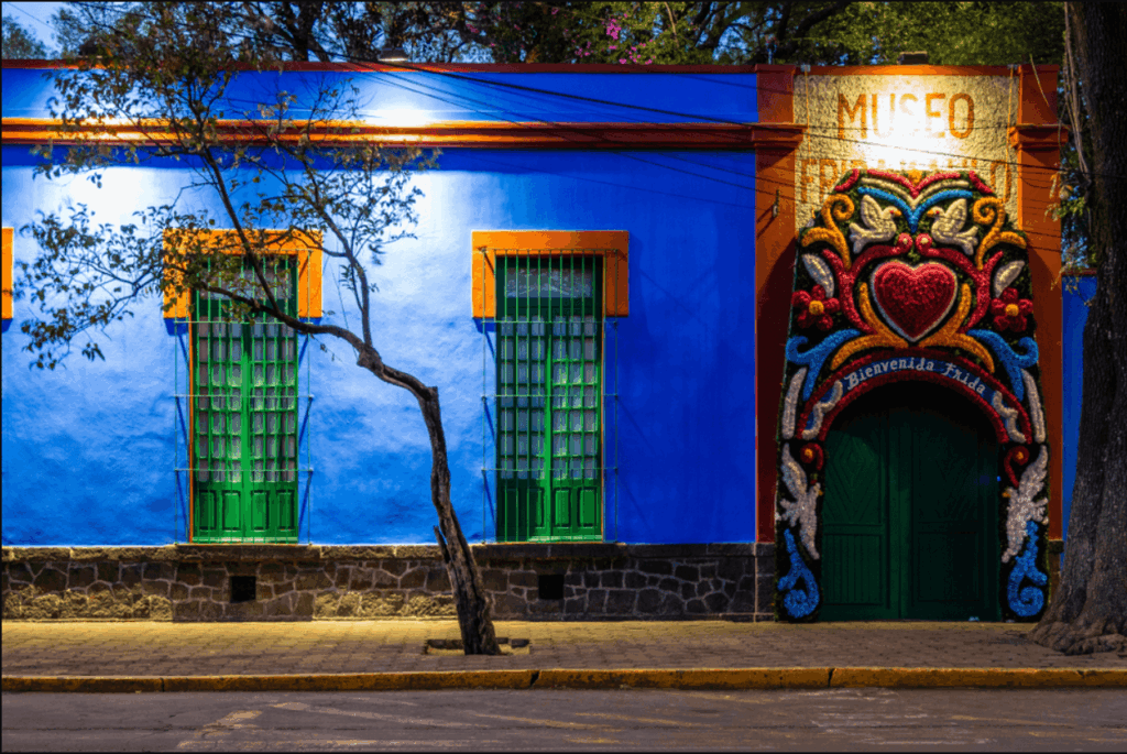 Cobalt blue exterior of Casa Azul with a floral-decorated doorway, Frida Kahlo Museum, Coyoacán